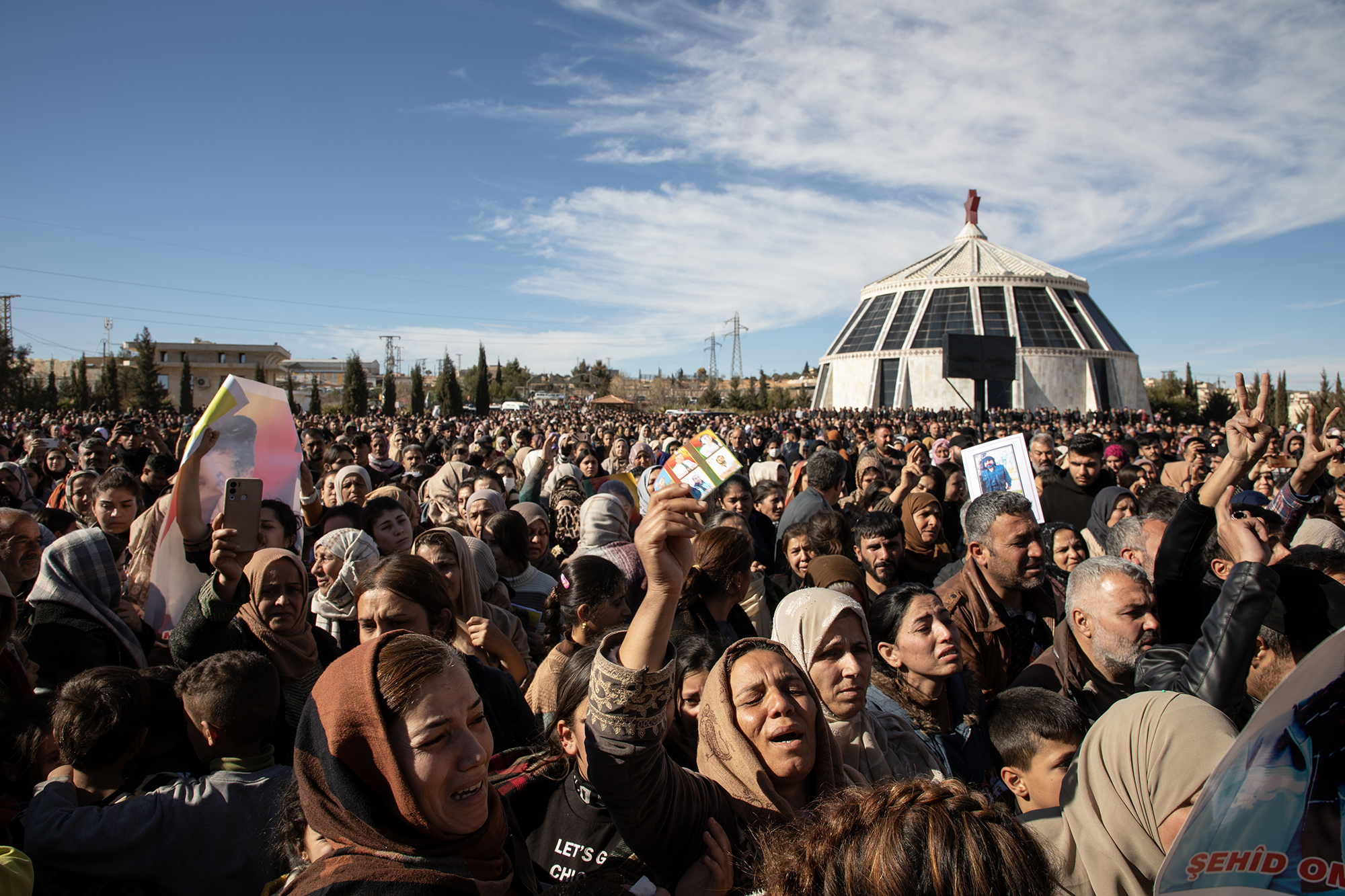 Thousands gather in Kobane's cemetery to mourn the victims of the January 15th attack on a convoy heading toward the Tishreen Dam. Funerals have sadly become routine amid ongoing Turkish attacks.