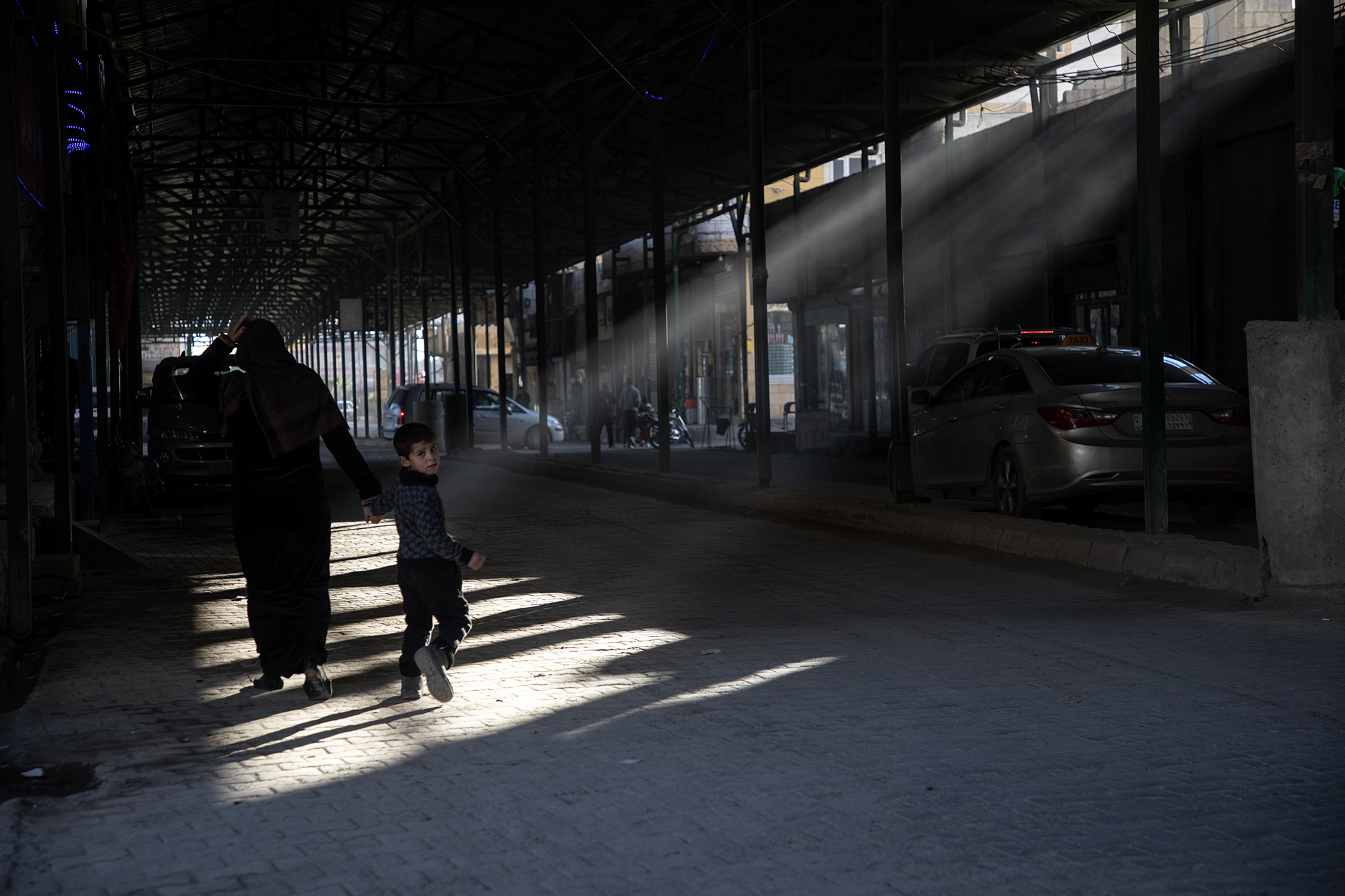To shield people in the bazaar from potential drone attacks, the Main Street and several adjoining streets are now covered, allowing only a faint trickle of daylight to filter through.