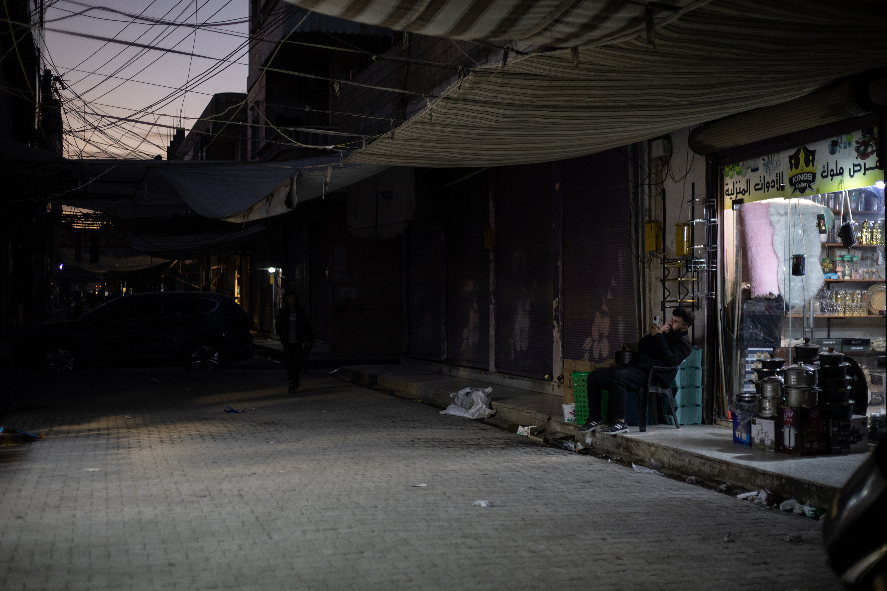 With no electricity at night, Kobane's busy bazaar empties after sunset. One by one, shops close, and near total darkness slowly takes over.
