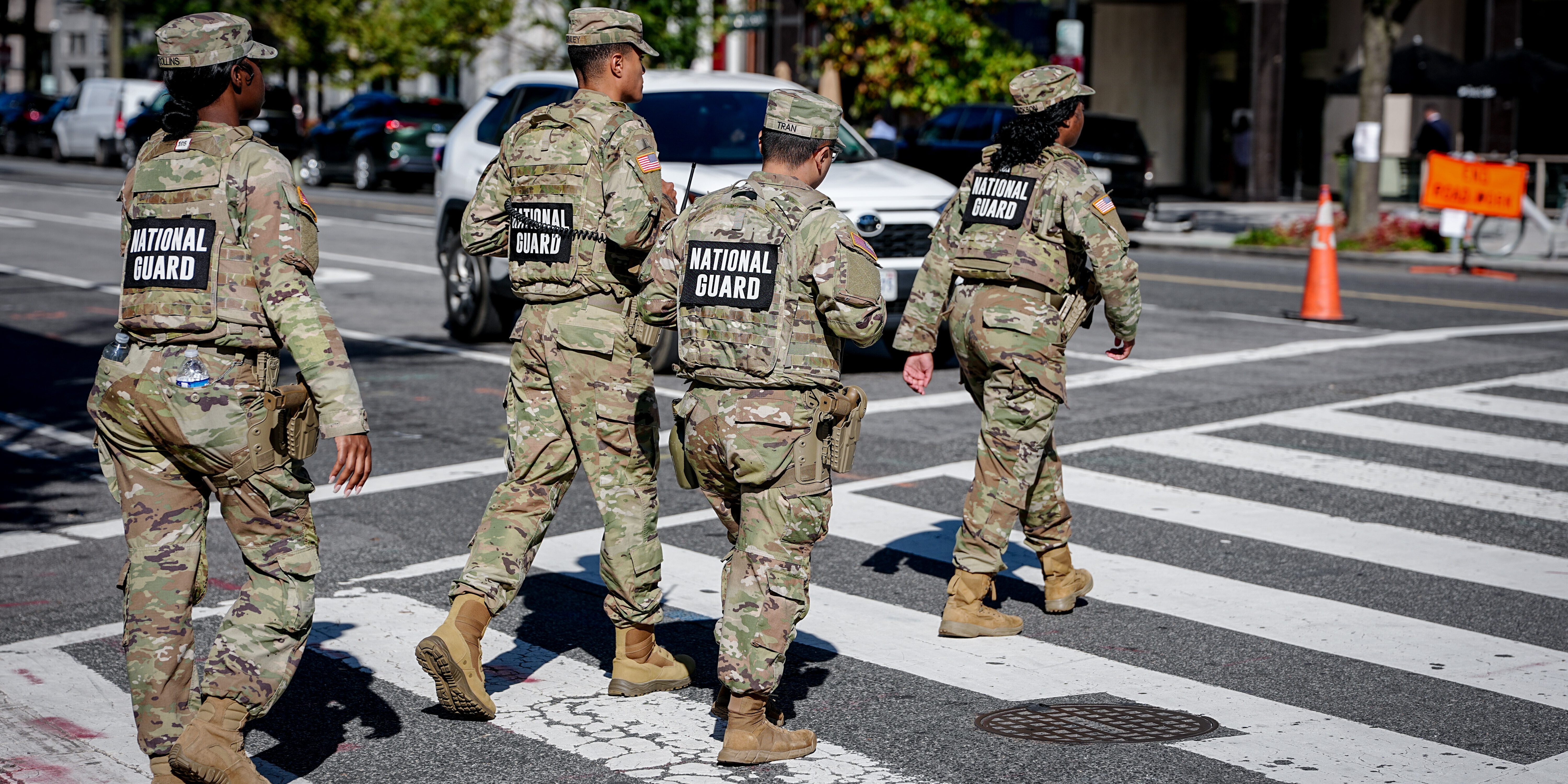 National Guard soldiers cross the street in downtown Washington, D.C. near the White House.
