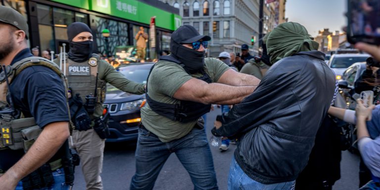 Federal agents and law enforcement conduct a raid on street vendors during rush hour on October 21, 2025 in New York City.
