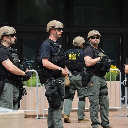 WASHINGTON, DC - JUNE 06: FBI officers stand guard at the J. Edgar Hoover Building during a protest against police brutality and racism on June 6, 2020 in Washington, DC. This is the 12th day of protests with people descending on the city to peacefully demonstrate in the wake of the death of George Floyd, a black man who was killed in police custody in Minneapolis on May 25. (Photo by Chip Somodevilla/Getty Images)