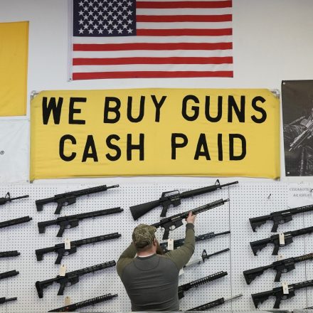 A salesperson takes an AR-15 rifle off the wall at a store in Orem, Utah, U.S., on Thursday, March 25, 2021. Two mass shootings in one week are giving Democrats new urgency to pass gun control legislation, but opposition from Republicans in the Senate remains the biggest obstacle to any breakthrough in the long-stalled debate. Photographer: George Frey/Bloomberg via Getty Images