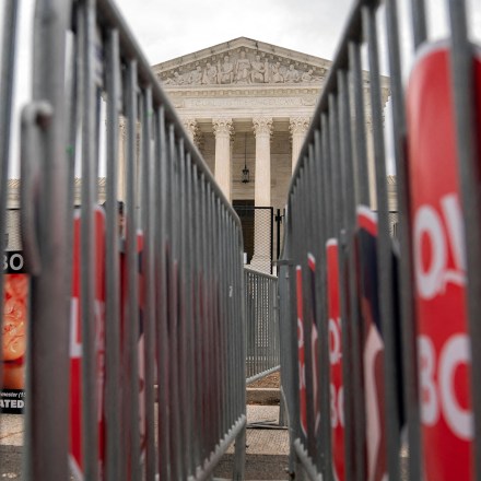 Love Them Both signs are displayed outside the US Supreme Court in Washington, DC, on June 27, 2022. - The Supreme Court released a decision on June 24, 2022, on the Dobbs v Jackson Womens Health Organization case, overturning the right to abortion. (Photo by Stefani Reynolds / AFP) (Photo by STEFANI REYNOLDS/AFP via Getty Images)