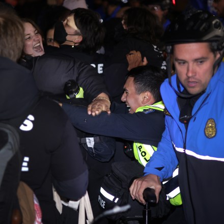 Members of U.S. Capitol Police pull protesters away from the headquarters of the Democratic National Committee during a demonstration against the war between Israel and Hamas on November 15, 2023 on Capitol Hill in Washington, DC.