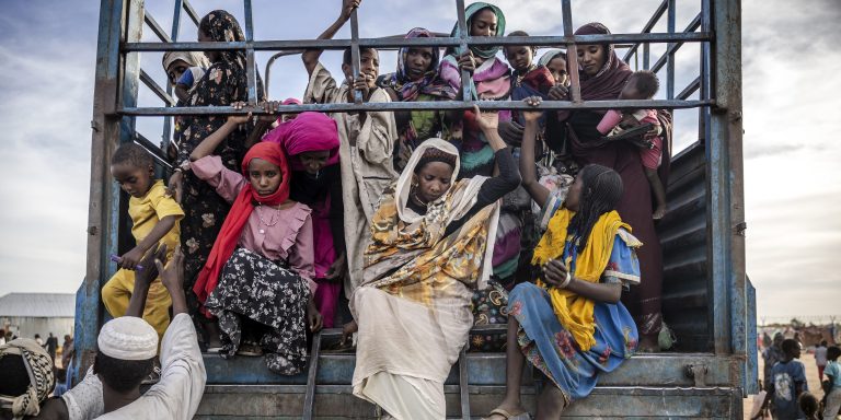 TOPSHOT - Sudanese refugees who have fled from the war in Sudan get off a truck loaded with families arriving at a Transit Centre for refugees in Renk, on February 13, 2024.More than 550,000 people have now fled from the war in Sudan to South Sudan since the conflict exploded in April 2023, according to the United Nations. South Sudan, that has itself recently come out of decades of war, was facing a dire humanitarian situation before the war in Sudan erupted and it is feared to not have the resources to host displaced people. The war-torn country of Sudan is currently ravaged by internal fighting between the Sudanese Army and the paramilitary Rapid Support Forces (RSF). (Photo by LUIS TATO / AFP) (Photo by LUIS TATO/AFP via Getty Images)