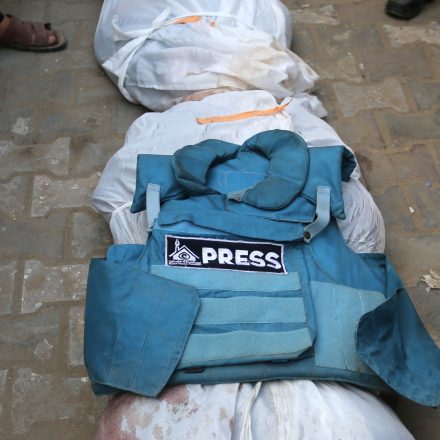 DEIR AL BALAH, GAZA - MARCH 06: Relatives, loved ones and colleagues of Al-Aqsa TV anchor and journalist Mohammed Salamah, who was killed in an Israeli army attack on a house, attend his funeral ceremony held in front of Al-Aqsa Martyrs Hospital in Deir Al Balah of Gaza on March 06, 2024. (Photo by Ashraf Amra/Anadolu via Getty Images)