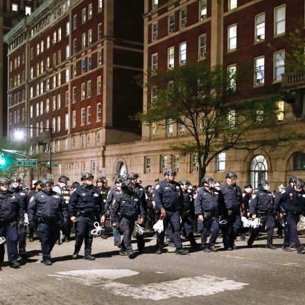 TOPSHOT - NYPD officers in riot gear march onto Columbia University campus, where pro-Palestinian students are barricaded inside a building and have set up an encampment, in New York City on April 30, 2024. Columbia University normally teems with students, but a "Free Palestine" banner now hangs from a building where young protesters have barricaded themselves and the few wandering through campus generally appear tense. Students here were among the first to embrace the pro-Palestinian campus encampment movement, which has spread to a number of universities across the United States. (Photo by KENA BETANCUR / AFP) (Photo by KENA BETANCUR/AFP via Getty Images)