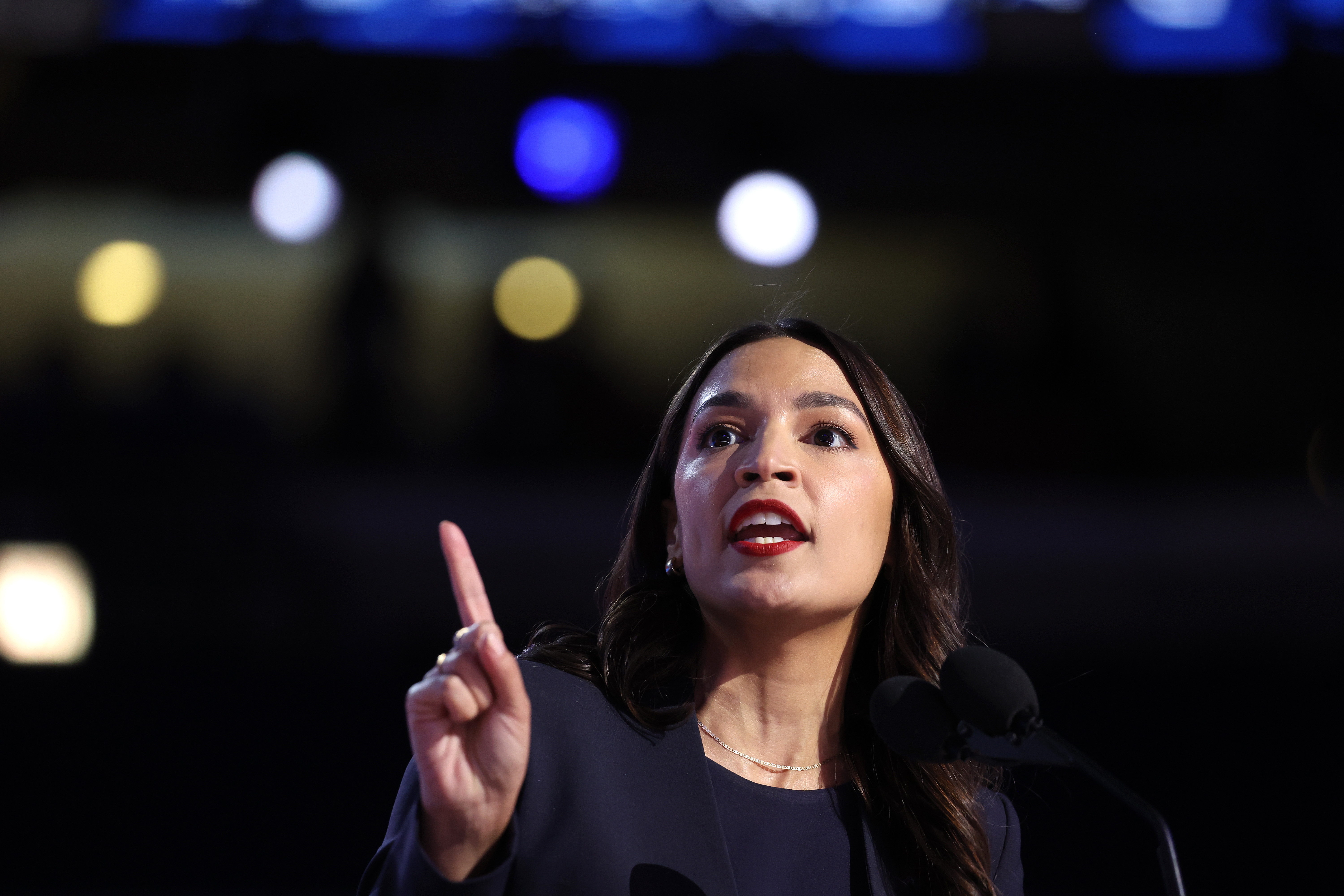 CHICAGO, ILLINOIS - AUGUST 19: Rep. Alexandria Ocasio-Cortez (D-NY) speaks onstage during the first day of the Democratic National Convention at the United Center on August 19, 2024 in Chicago, Illinois. Delegates, politicians, and Democratic party supporters are in Chicago for the convention, concluding with current Vice President Kamala Harris accepting her party's presidential nomination. The DNC takes place from August 19-22. (Photo by Justin Sullivan/Getty Images)