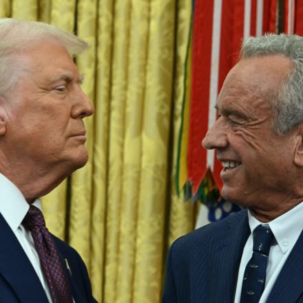 The new US Secretary of Health and Human Services Robert F. Kennedy Jr., shakes hands with US President Donald Trump after a swearing in ceremony in the Oval Office of the White House in Washington, DC, on February 13, 2025. (Photo by ANDREW CABALLERO-REYNOLDS / AFP) (Photo by ANDREW CABALLERO-REYNOLDS/AFP via Getty Images)