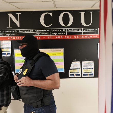 Federal agents patrol the halls of immigration court at the Jacob K. Javitz Federal Building on August 01, 2025 in New York City.