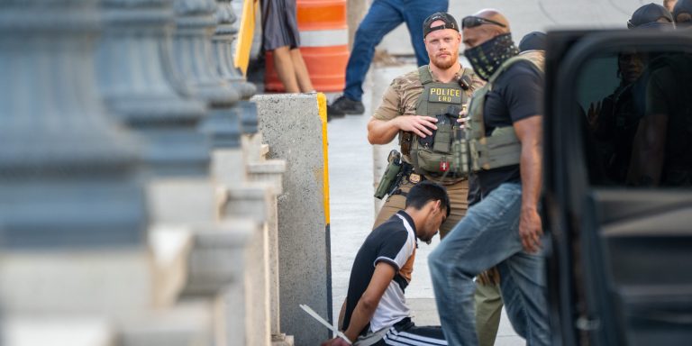 WASHINGTON, DC - AUGUST 16: ICE and other federal agents take a delivery driver into custody at Union Station on August 16, 2025 in Washington, DC. U.S. President Donald Trump announced plans to deploy federal officers and the National Guard to the District in order to place the DC Metropolitan Police Department under federal control and assist in crime prevention in the nation's capital.  (Photo by Andrew Leyden/Getty Images)
