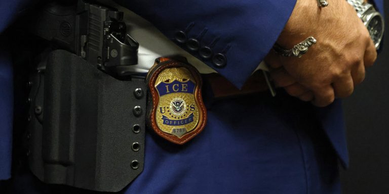 ARLINGTON, TEXAS - AUGUST 26:  A detail view of the badge worn by Matthew Elliston, deputy assistant director of field operations at ICE headquarters in Washington. U.S. Immigration and Customs Enforcement (ICE) hold a major hiring event on August 26, 2025 in Arlington, Texas. The federal immigration agency is ramping up recruiting efforts nationwide. (Photo by Ron Jenkins/Getty Images)