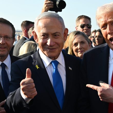 TEL AVIV, ISRAEL - OCTOBER 13:  U.S. President Donald Trump poses with Israeli President Isaac Herzog and Israeli Prime Minister Benjamin Netanyahu at Ben Gurion International Airport before boarding his plane to Sharm El-Sheikh, on October 13, 2025 in Tel Aviv, Israel. President Trump is visiting the country hours after Hamas released the remaining Israeli hostages captured on Oct. 7, 2023, part of a US-brokered ceasefire deal to end the war in Gaza. (Photo by Chip Somodevilla/Getty Images)