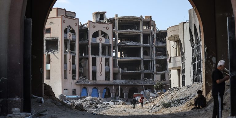 GAZA CITY, GAZA - OCTOBER 16: A view of the area as many Palestinian families who were forced to migrate south due to Israeli attacks return to the Islamic University, where they previously stayed, as a ceasefire is established, despite many buildings being destroyed or heavily damaged by the attacks, on October 16, 2025. (Photo by Khames Alrefi/Anadolu via Getty Images)