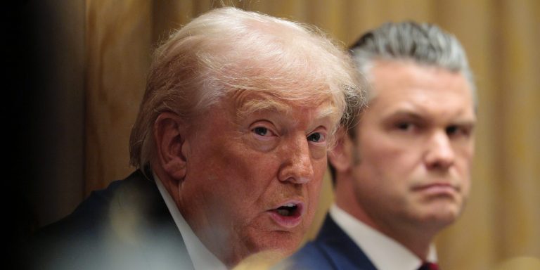 U.S. Secretary of War Pete Hegseth looks on as U.S. President Donald Trump speaks during a meeting of his Cabinet in the Cabinet Room of the White House on December 02, 2025 in Washington, DC.