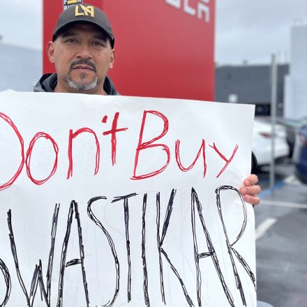 Victor Alcala stands outside the Tesla showroom in Alhambra, Calif., on March 14, 2025.