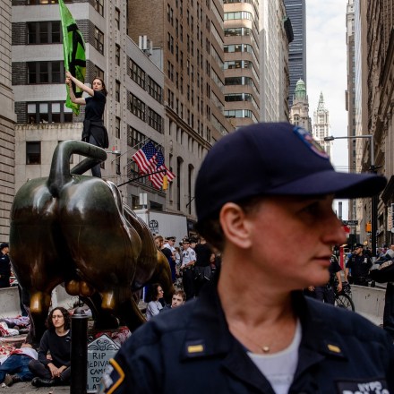 NEW YORK, NEW YORK– OCTOBER 7, 2019: The environmental group Extinction Rebellion (commonly referred to as XR) stage a "die in" at the Charging Bull. XR lead a group of protesters in marching and action in Manhattan on Monday. Numerous members were arrested.